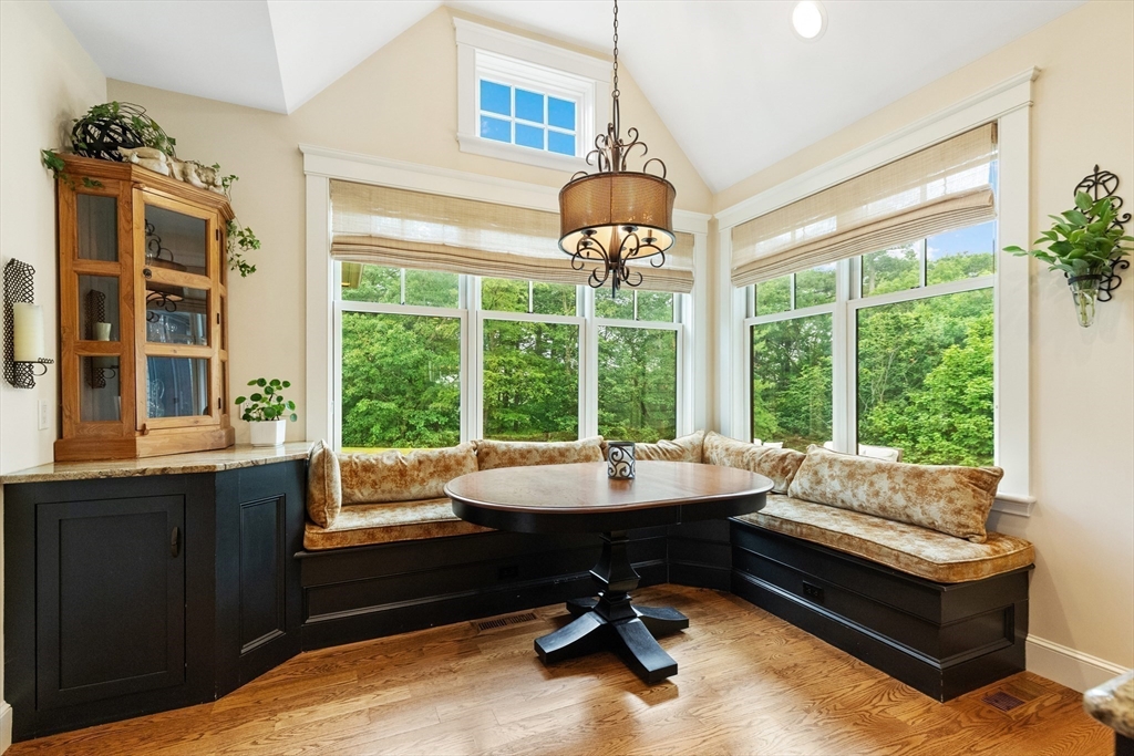 27 Whitehall Circle Beverly, MA 01915 - Photo 6 of 42 a living room with furniture and a chandelier