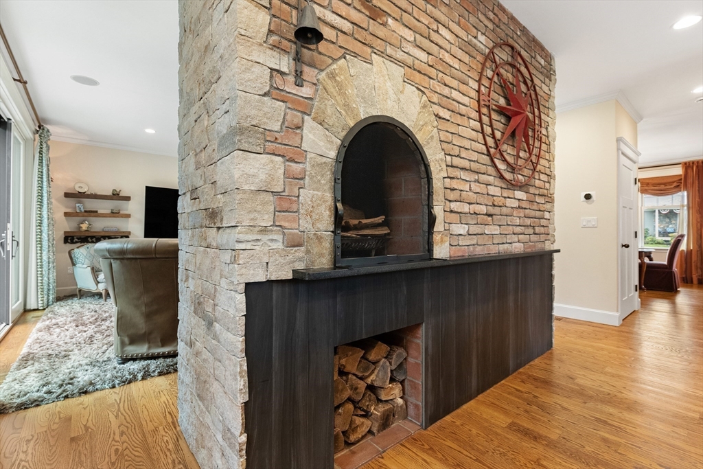 27 Whitehall Circle Beverly, MA 01915 - Photo 9 of 42 a view of livingroom with fireplace and wooden floor