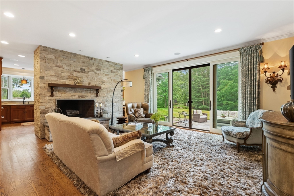 27 Whitehall Circle Beverly, MA 01915 - Photo 10 of 42 a living room with furniture and a fireplace