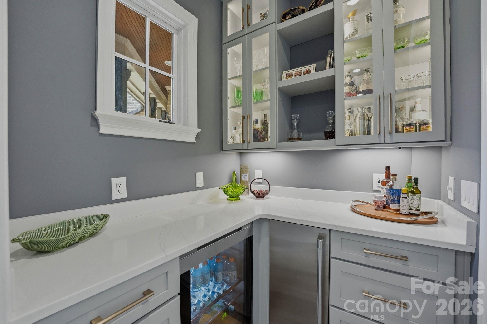 7416 Lee Rea Road Charlotte, NC 28226 - Photo 21 of 48 a kitchen with a sink and a stove with wooden floor