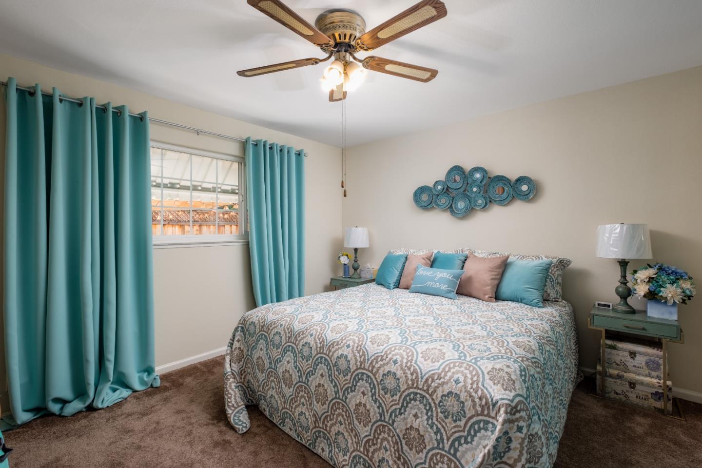 265 Bieber Drive San Jose, CA 95123 - Photo 15 of 28 a bedroom with a bed and a chandelier