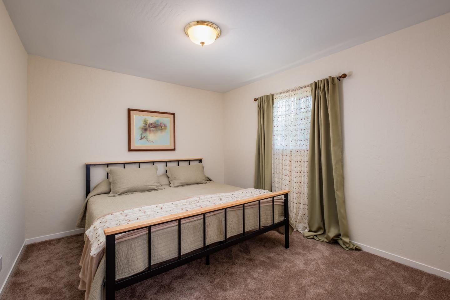 265 Bieber Drive San Jose, CA 95123 - Photo 16 of 28 a bedroom with a bed and a window