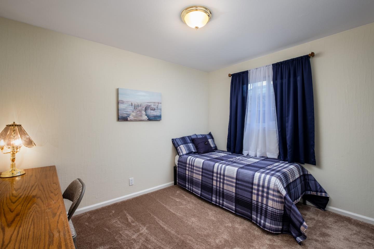 265 Bieber Drive San Jose, CA 95123 - Photo 17 of 28 a bedroom with a bed and a window