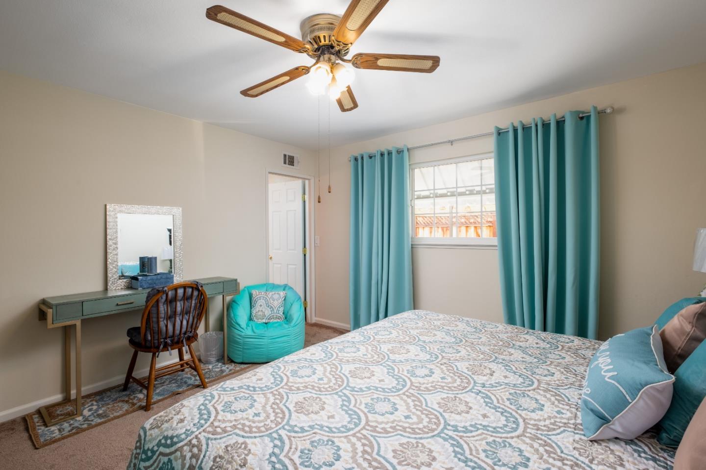 265 Bieber Drive San Jose, CA 95123 - Photo 19 of 28 a bedroom with bed and a chandelier