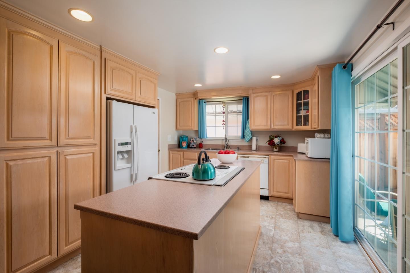265 Bieber Drive San Jose, CA 95123 - Photo 9 of 28 a kitchen with white cabinets and refrigerator
