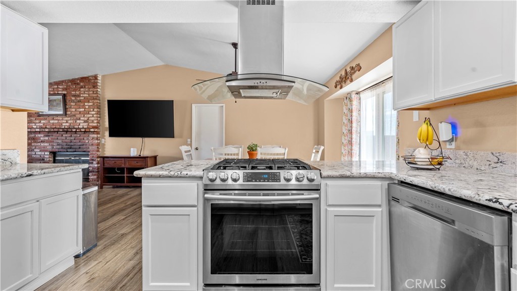 11639 Pagosi Road Apple Valley, CA 92308 - Photo 14 of 37 a kitchen with a stove and a sink