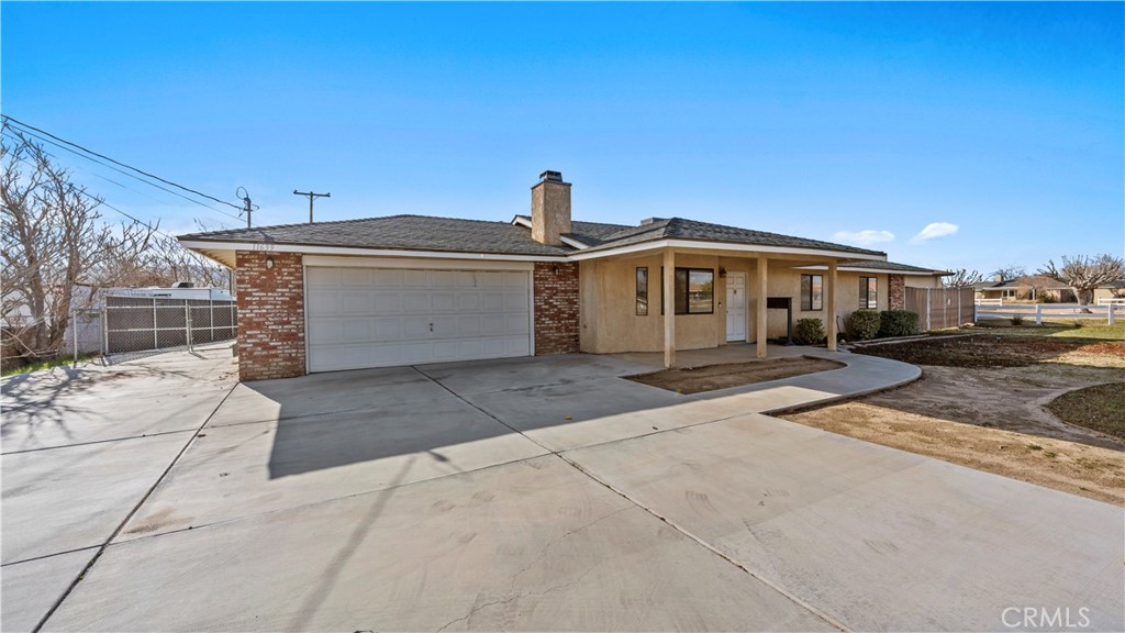 11639 Pagosi Road Apple Valley, CA 92308 - Photo 2 of 37 a front view of a house with a yard