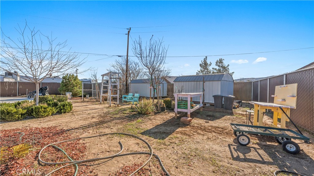 11639 Pagosi Road Apple Valley, CA 92308 - Photo 22 of 37 a view of a house with backyard porch and sitting area