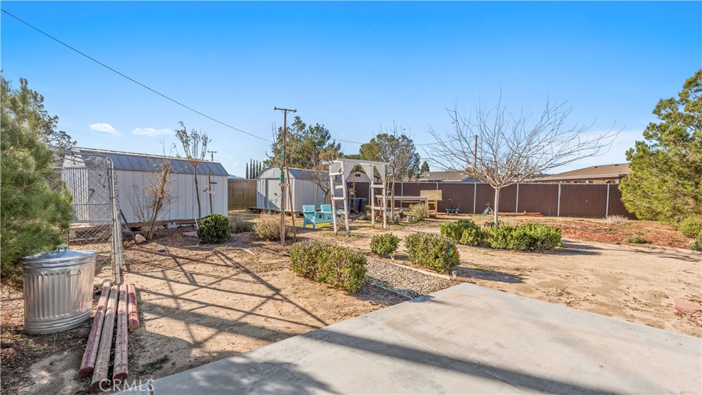 11639 Pagosi Road Apple Valley, CA 92308 - Photo 23 of 37 a view of a house with backyard and sitting area