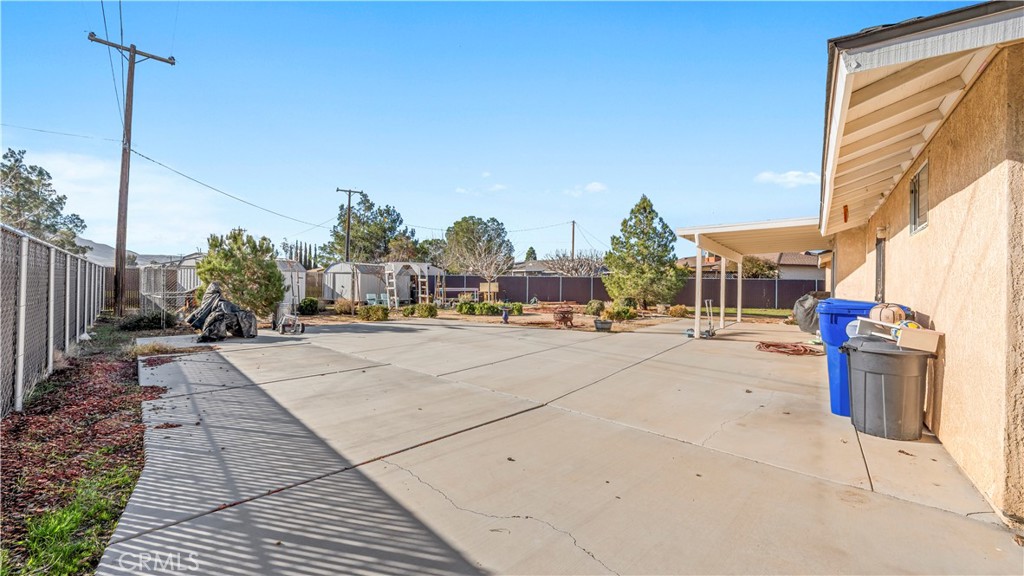 11639 Pagosi Road Apple Valley, CA 92308 - Photo 25 of 37 a view of a yard in front of a house