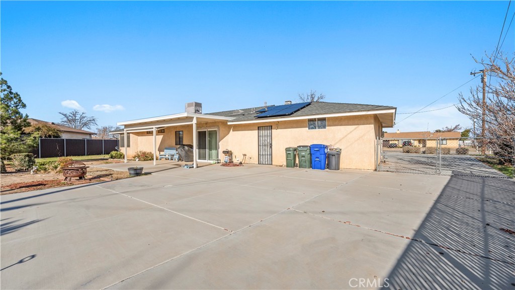 11639 Pagosi Road Apple Valley, CA 92308 - Photo 26 of 37 a front view of a house with a yard