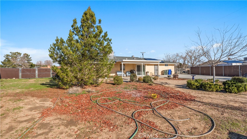 11639 Pagosi Road Apple Valley, CA 92308 - Photo 27 of 37 a view of a house with backyard
