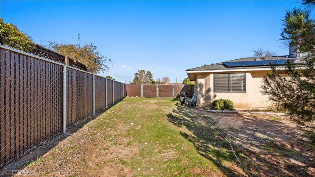11639 Pagosi Road Apple Valley, CA 92308 - Photo 28 of 37 a view of a house with backyard and sitting area