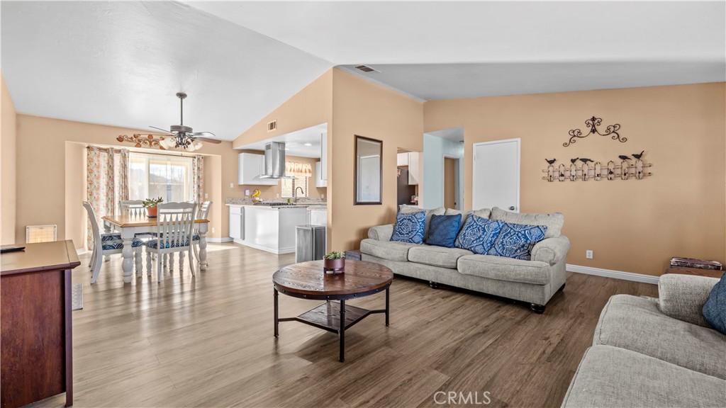 11639 Pagosi Road Apple Valley, CA 92308 - Photo 6 of 37 a living room with furniture and a chandelier