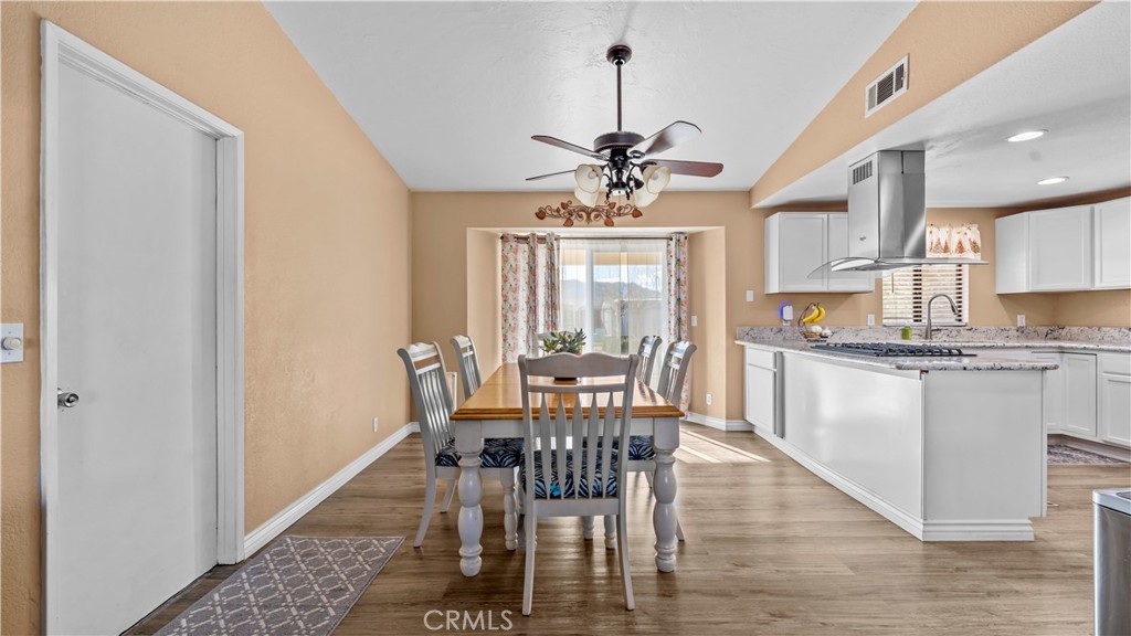 11639 Pagosi Road Apple Valley, CA 92308 - Photo 8 of 37 a view of a dining room with furniture window and outside view