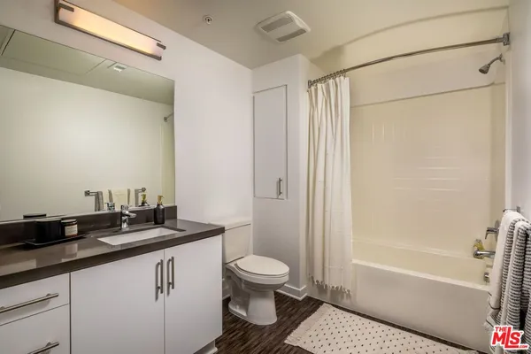 a kitchen with a sink stove and microwave