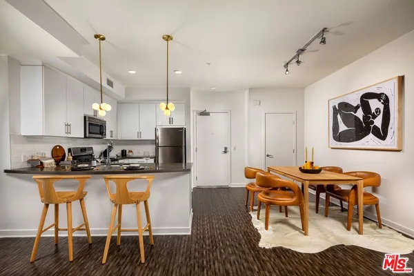 a kitchen with a sink stove and refrigerator
