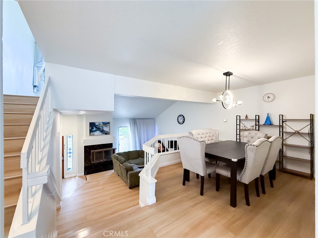 33 Wildflower Place Phillips Ranch, CA 91766 - Photo 12 of 49 a view of a dining room with furniture and wooden floor