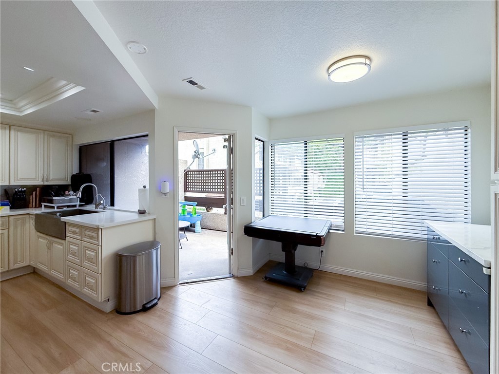 33 Wildflower Place Phillips Ranch, CA 91766 - Photo 19 of 49 a living room with stainless steel appliances kitchen island hardwood floor and a sink