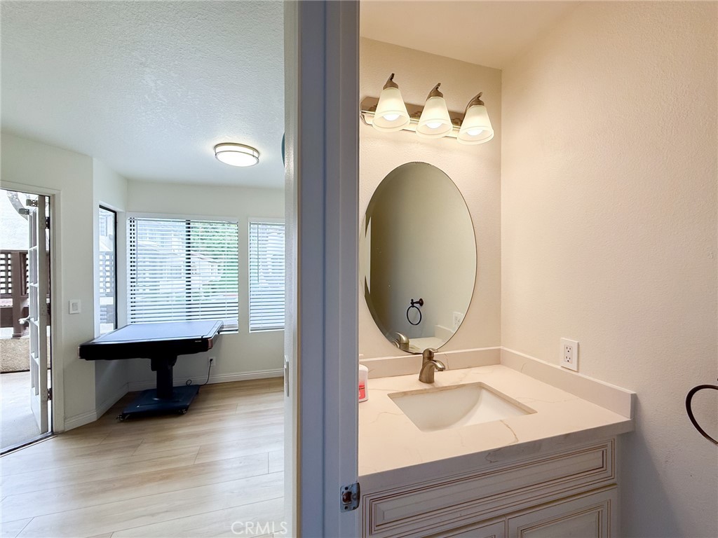 33 Wildflower Place Phillips Ranch, CA 91766 - Photo 24 of 49 a bathroom with a sink and a mirror