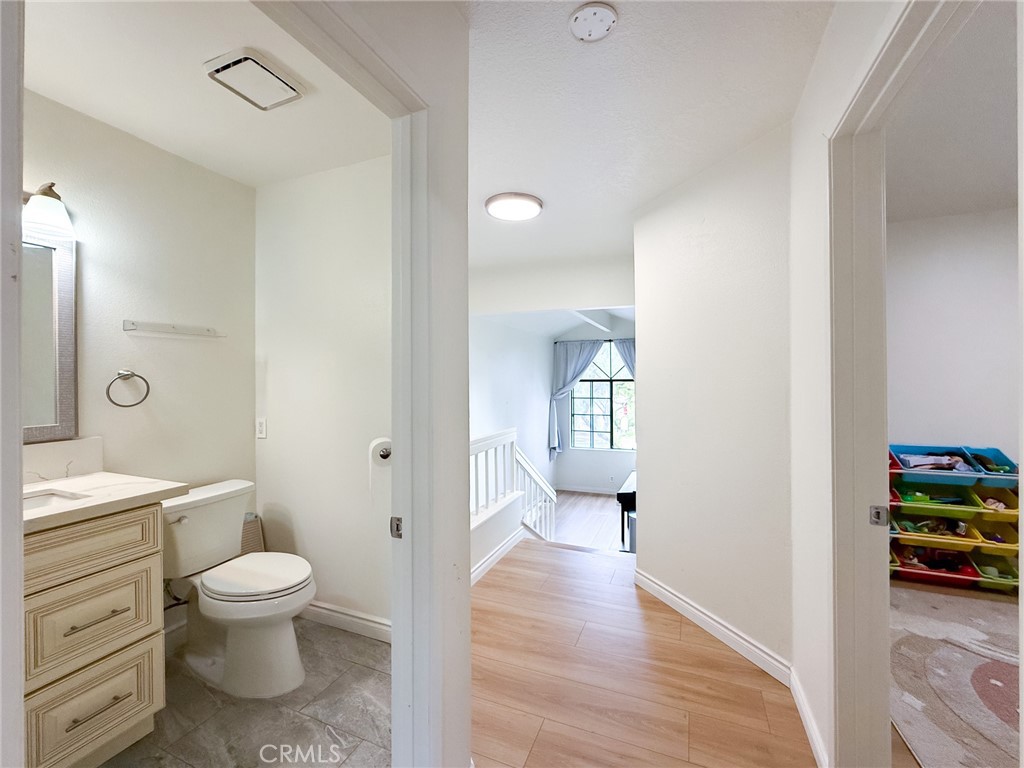 33 Wildflower Place Phillips Ranch, CA 91766 - Photo 34 of 49 a bathroom with a toilet a sink and a view of bathroom