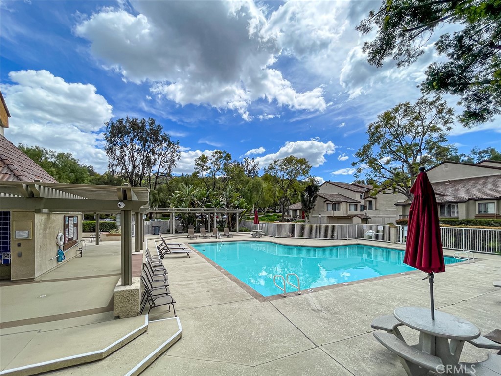 33 Wildflower Place Phillips Ranch, CA 91766 - Photo 44 of 49 a view of a swimming pool with a bench in front of house