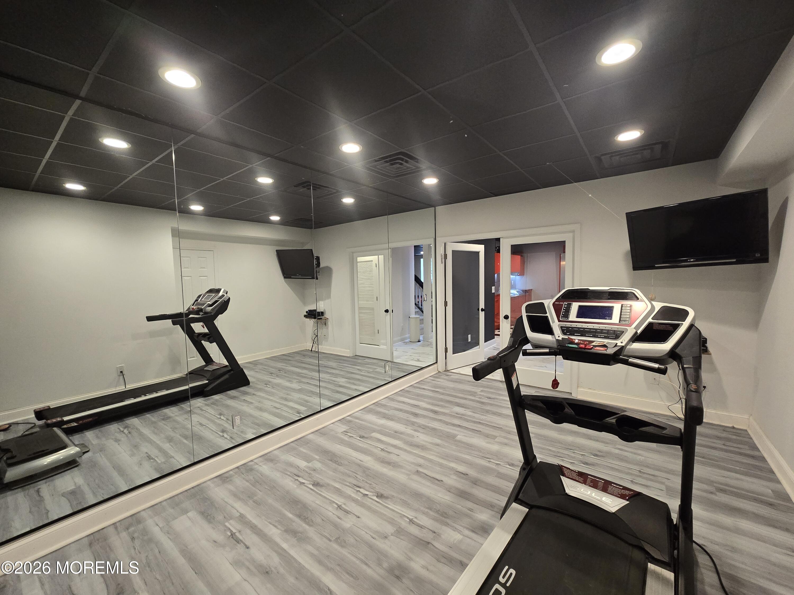 112 Beacon Hill Road Morganville, NJ 07751 - Photo 45 of 53 a view of a room with gym equipment