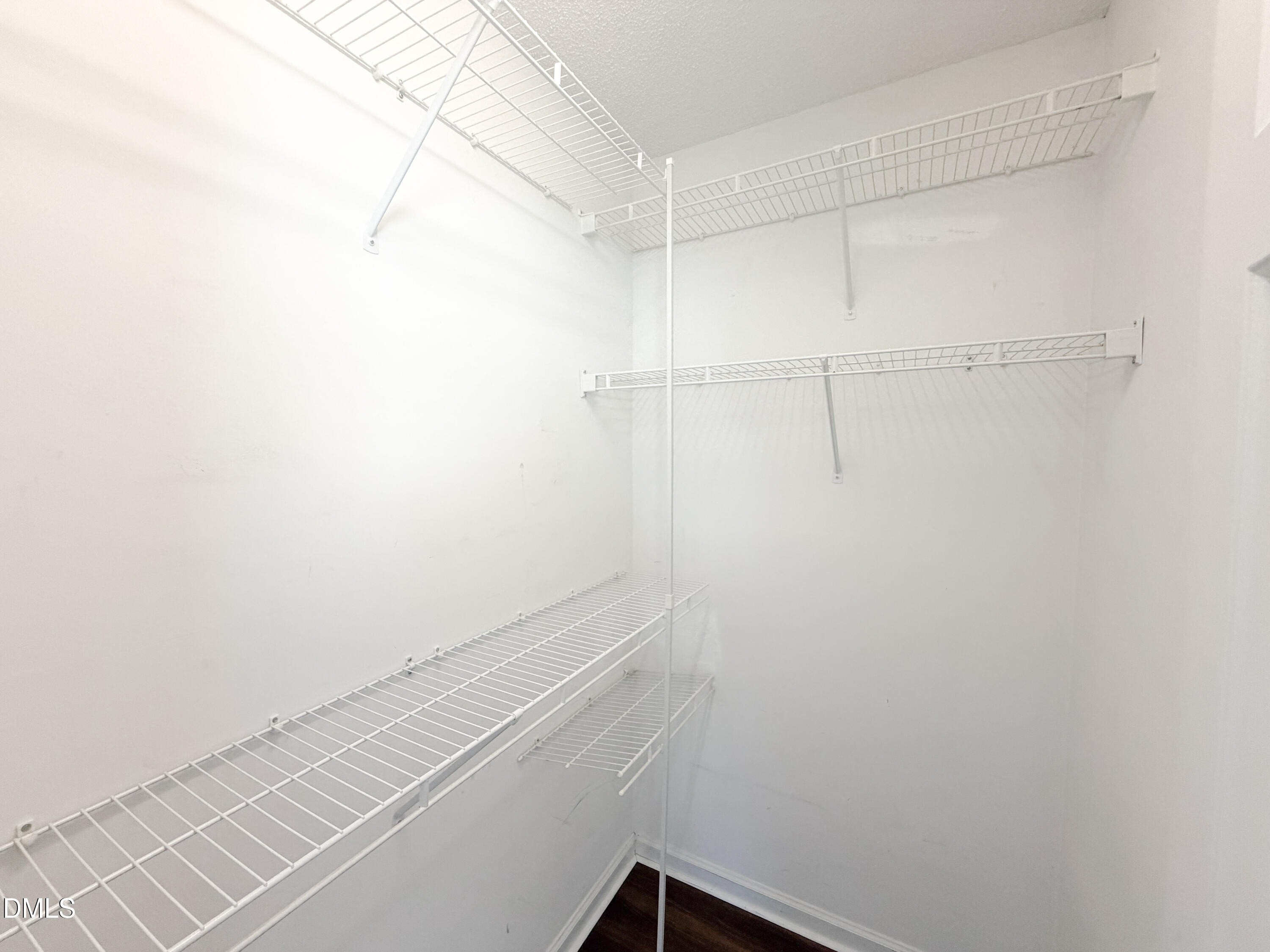 6304 Forest Ridge Drive Durham, NC 27713 - Photo 19 of 29 a view of a room with racks on the wall
