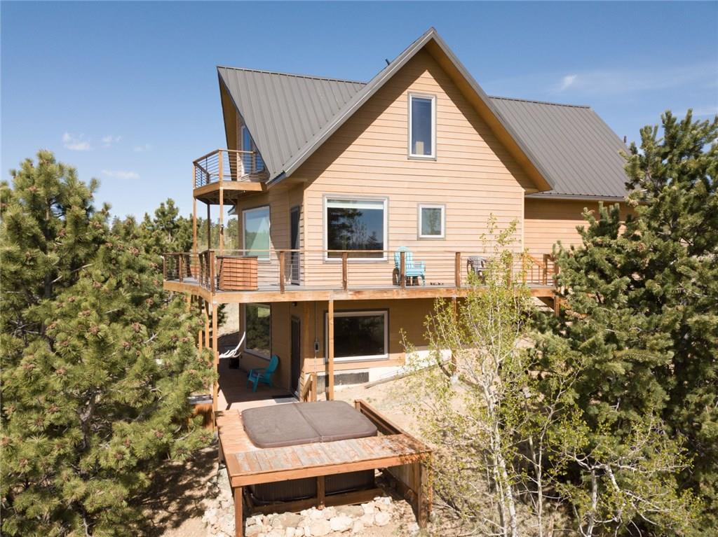 138 Teton Way Como, CO 80432 - Photo 2 of 35 a view of house with a yard and sitting area