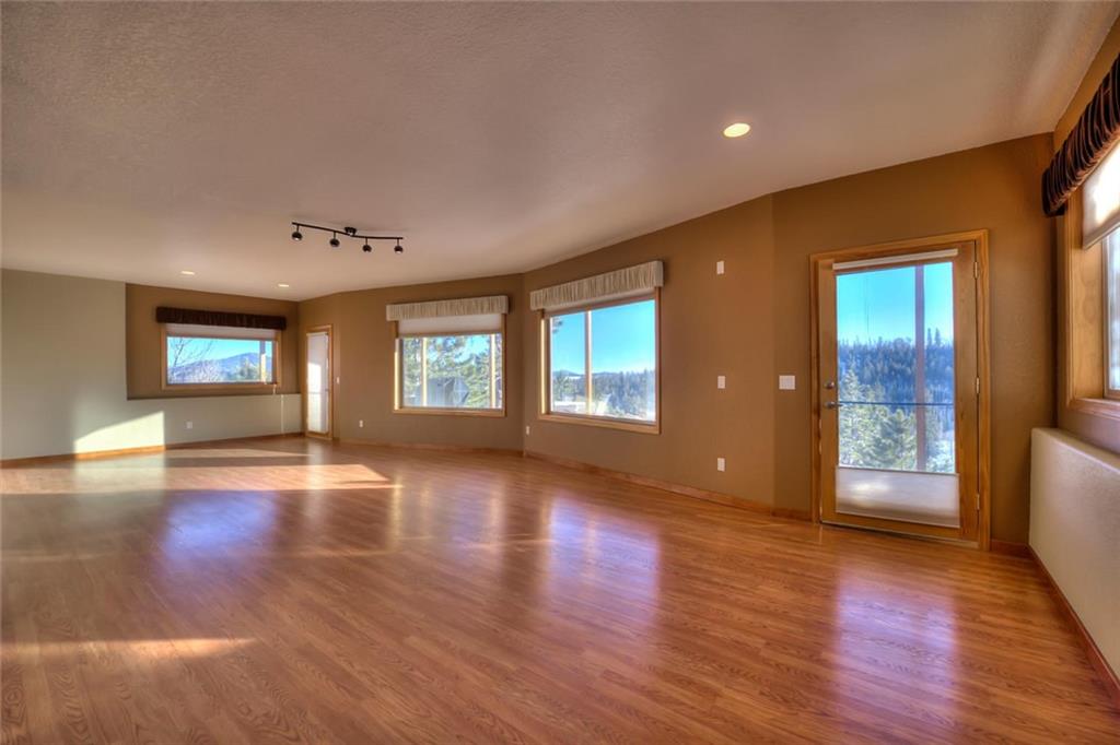 138 Teton Way Como, CO 80432 - Photo 11 of 35 a view of an empty room with window and wooden floor