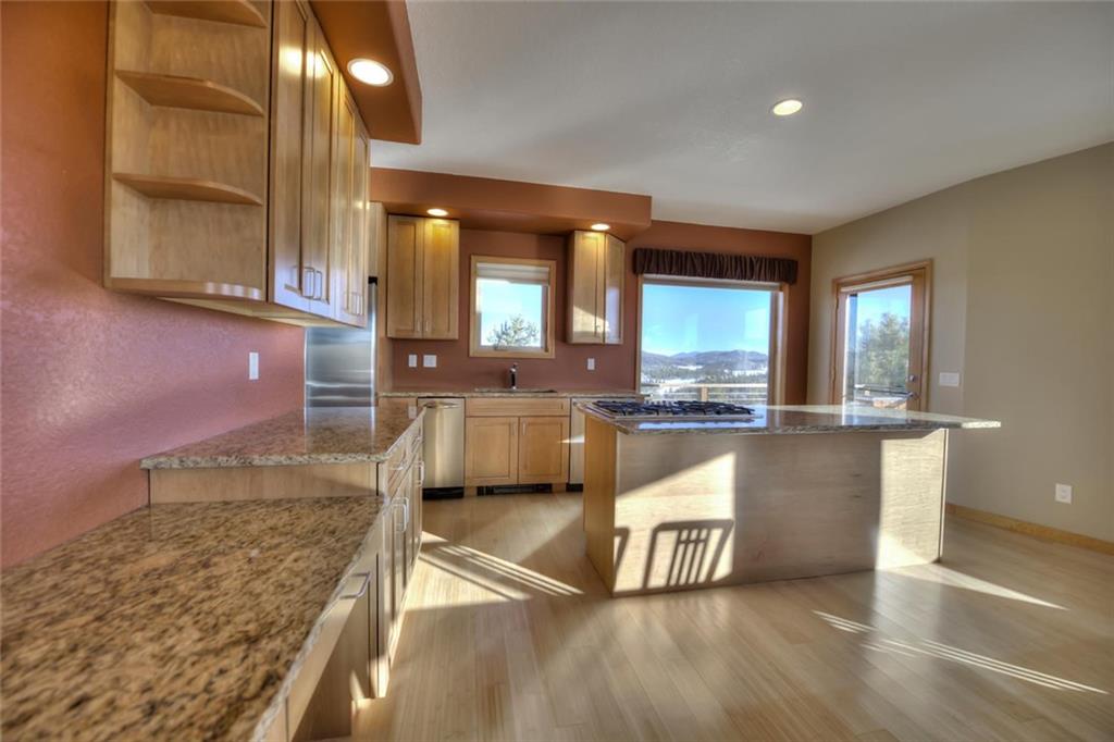 138 Teton Way Como, CO 80432 - Photo 17 of 35 a kitchen with stainless steel appliances granite countertop a sink and a stove