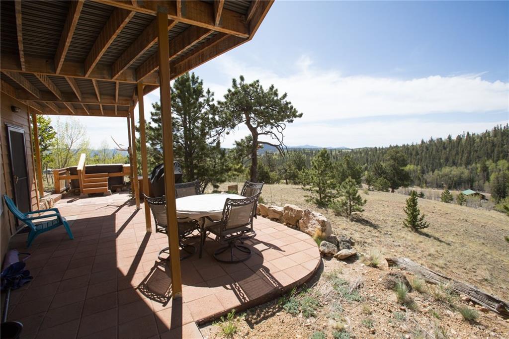 138 Teton Way Como, CO 80432 - Photo 3 of 35 a view of a tables and chairs under the roof