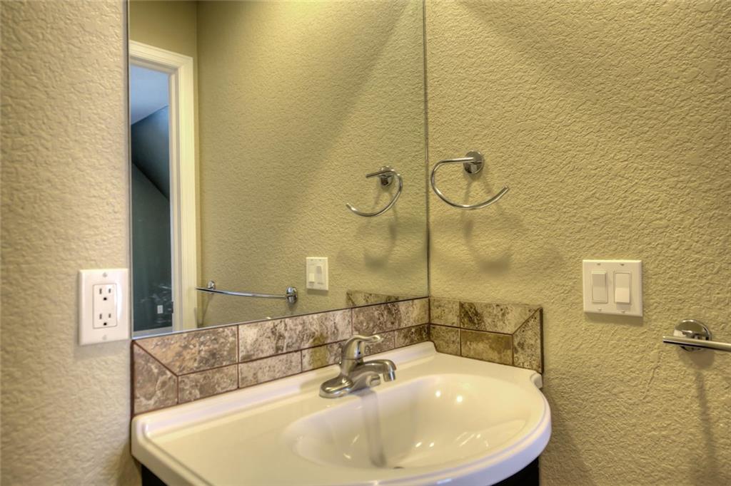 138 Teton Way Como, CO 80432 - Photo 25 of 35 a bathroom with a sink and a mirror