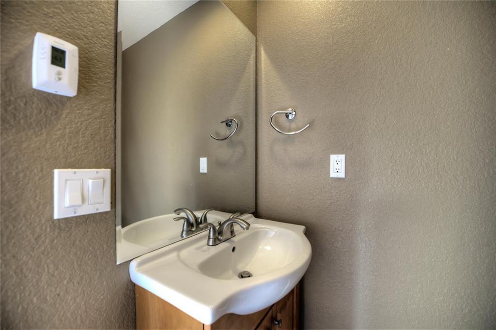138 Teton Way Como, CO 80432 - Photo 27 of 35 a bathroom with a sink and a mirror