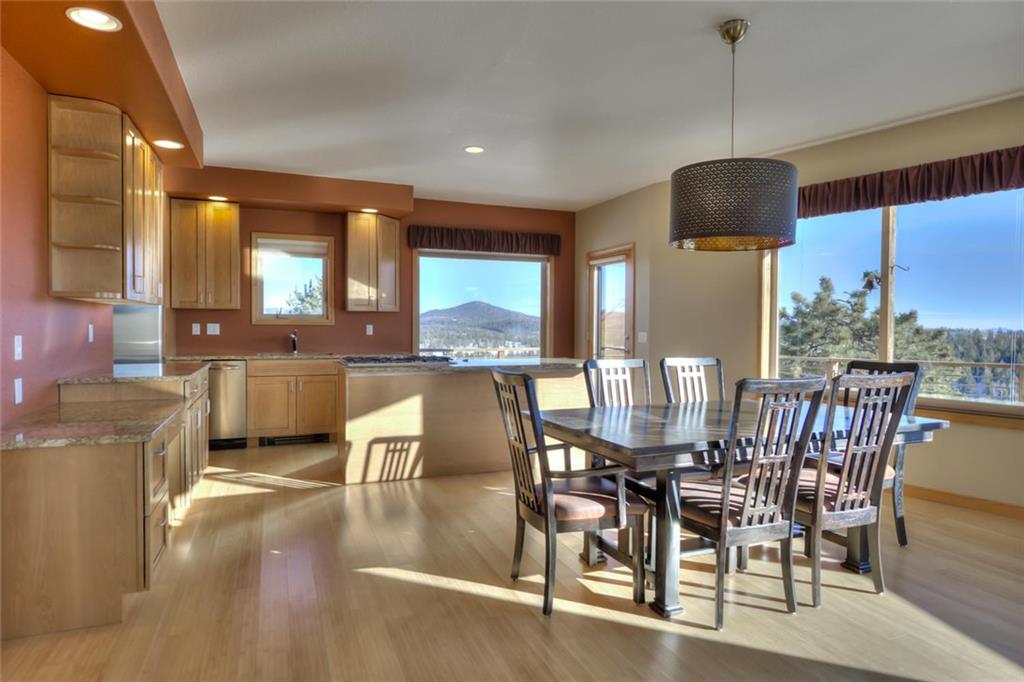 138 Teton Way Como, CO 80432 - Photo 4 of 35 a dining room with furniture a chandelier and wooden floor
