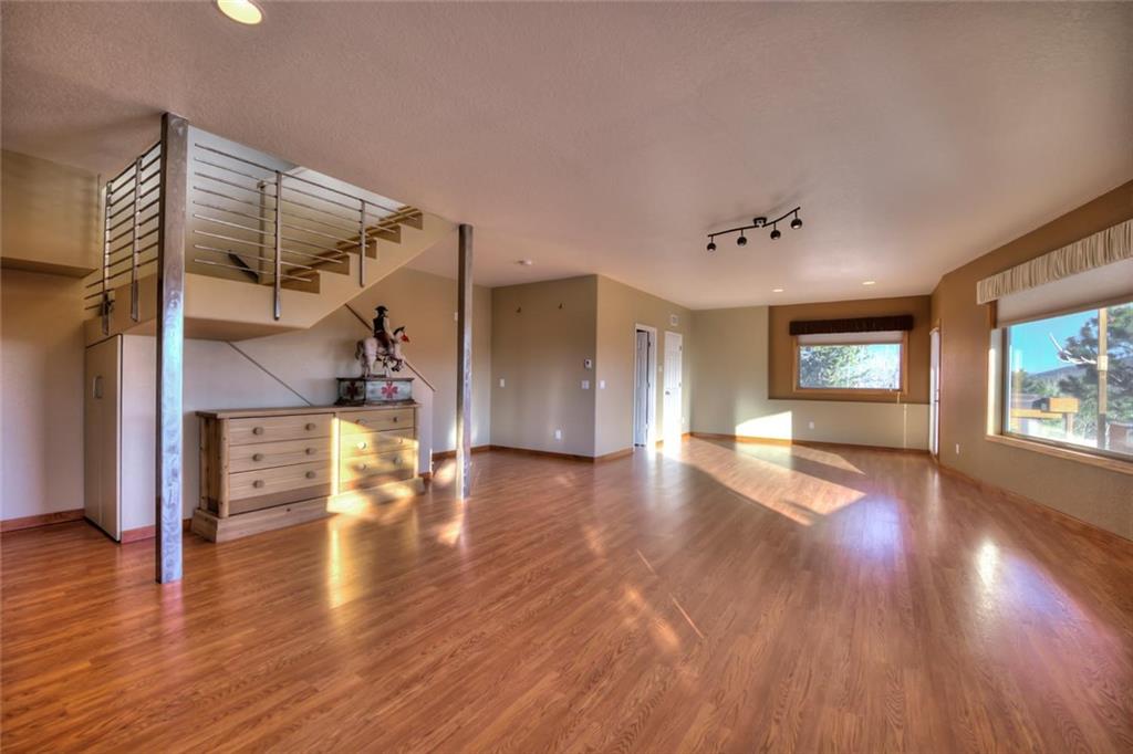 138 Teton Way Como, CO 80432 - Photo 10 of 35 a view of a room with wooden floors
