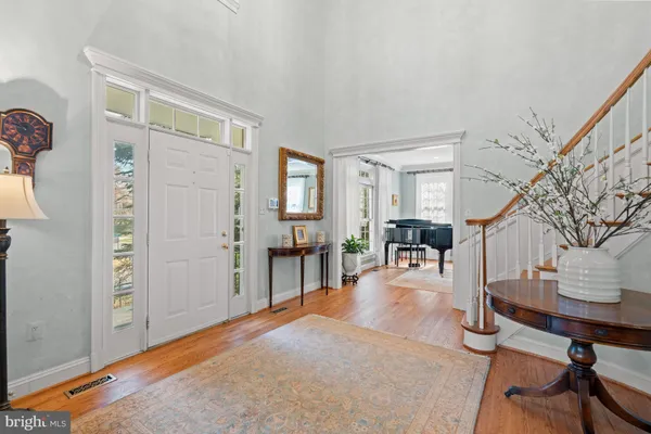 a room with lots of furniture and a chandelier
