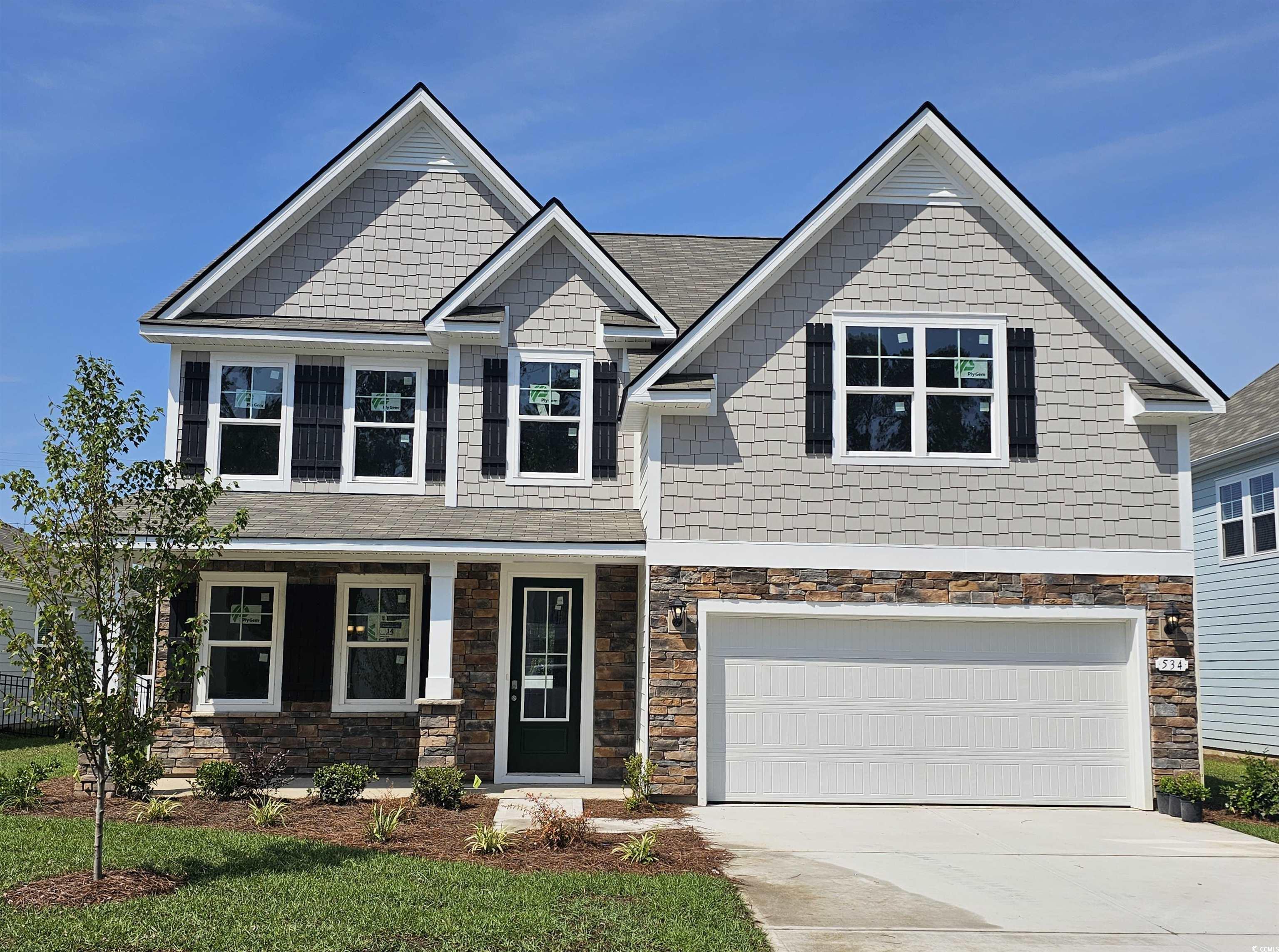 534 Haven View Way Murrells Inlet, SC 29576 - Photo 1 of 32 Craftsman-style home featuring driveway, stone siding, and a garage