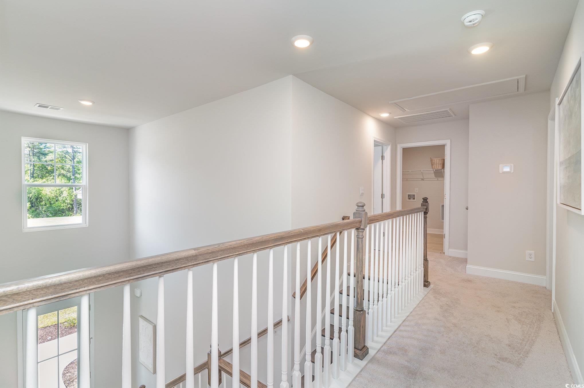 534 Haven View Way Murrells Inlet, SC 29576 - Photo 14 of 32 Hall with recessed lighting, visible vents, an upstairs landing, and light carpet