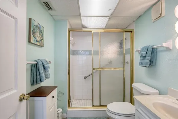 a bathroom with a sink mirror and vanity