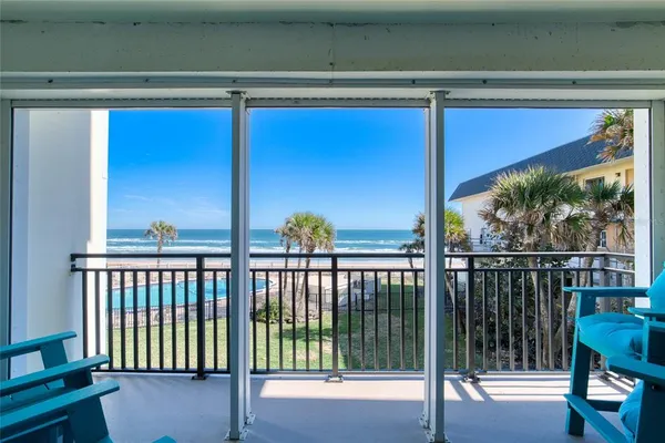 a view of a balcony dining area