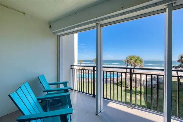 a view of balcony with wooden floor