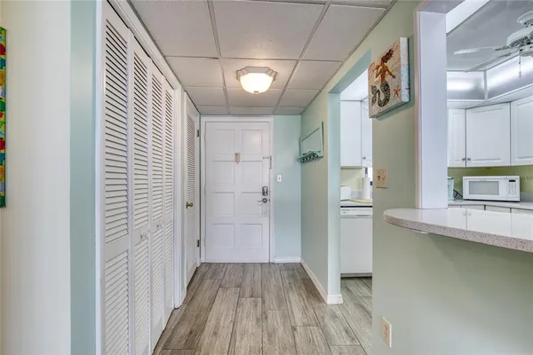 a view of a hallway view with wooden floor and staircase