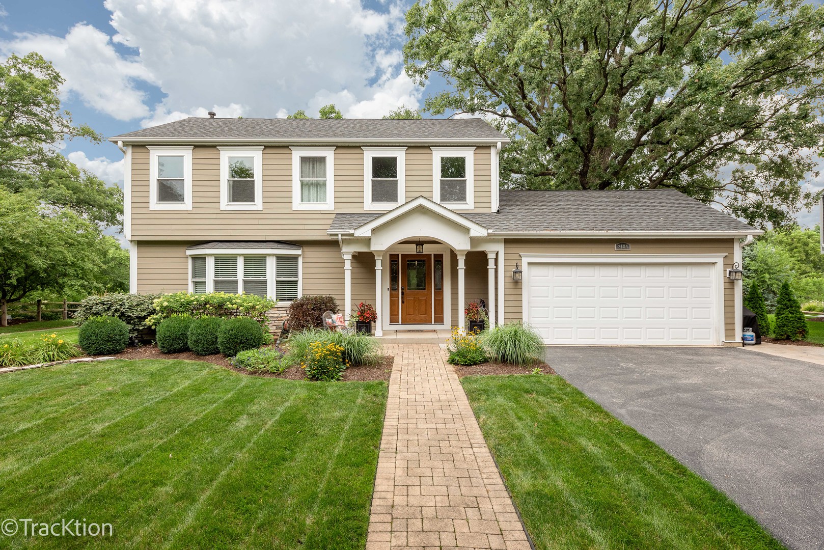 2184 Riverlea Circle Naperville, IL 60565 - Photo 1 of 20 a front view of a house with yard and green space