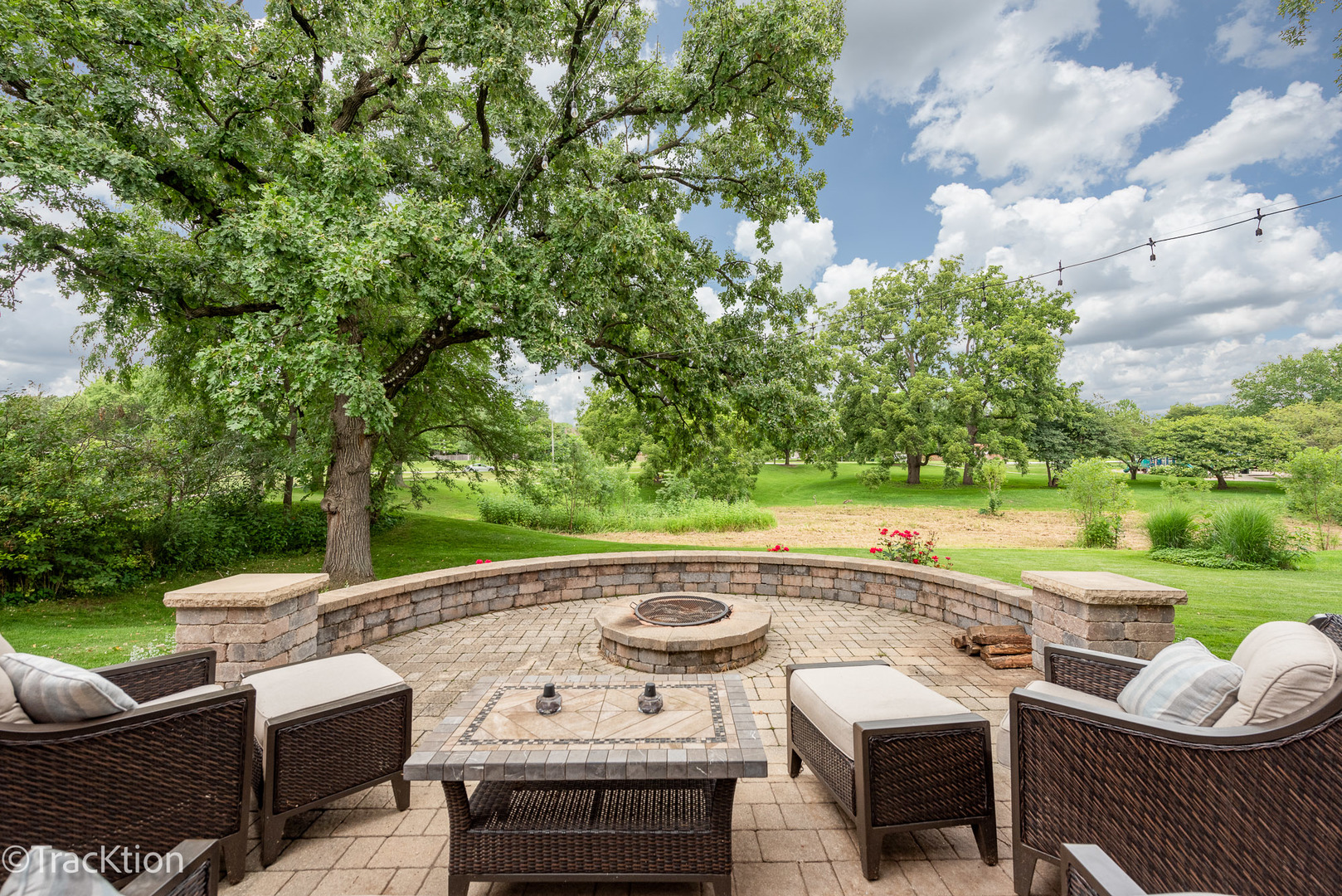 2184 Riverlea Circle Naperville, IL 60565 - Photo 18 of 20 a view of a patio with lawn chairs next to a yard