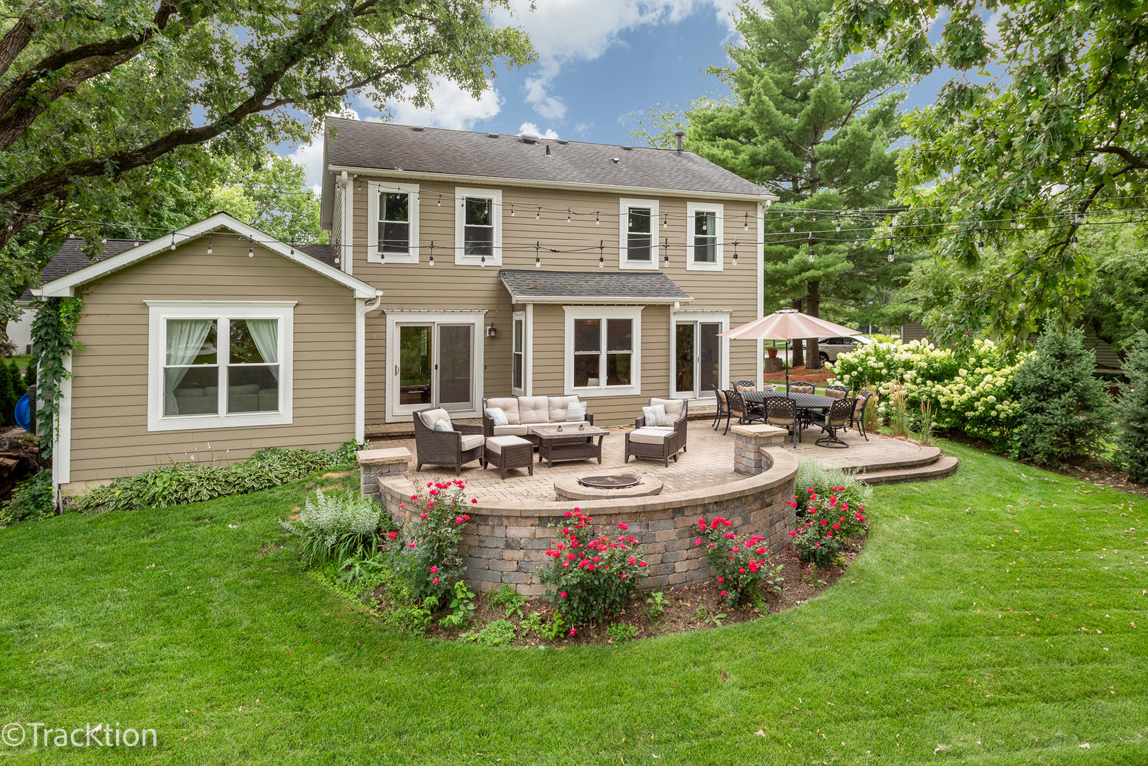 2184 Riverlea Circle Naperville, IL 60565 - Photo 19 of 20 a view of a house with backyard sitting area and garden