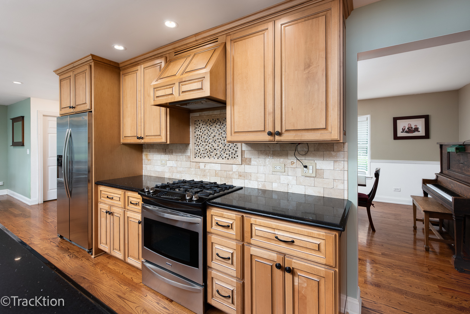 2184 Riverlea Circle Naperville, IL 60565 - Photo 5 of 20 a kitchen with stainless steel appliances granite countertop a stove a sink and a microwave