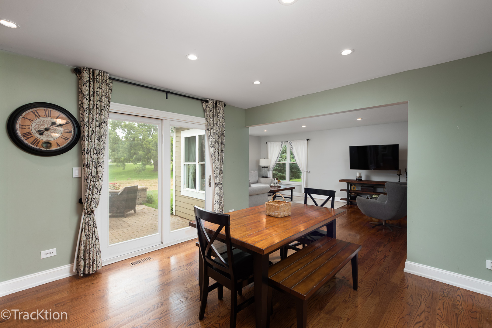 2184 Riverlea Circle Naperville, IL 60565 - Photo 7 of 20 a view of a dining room with furniture wooden floor and a rug