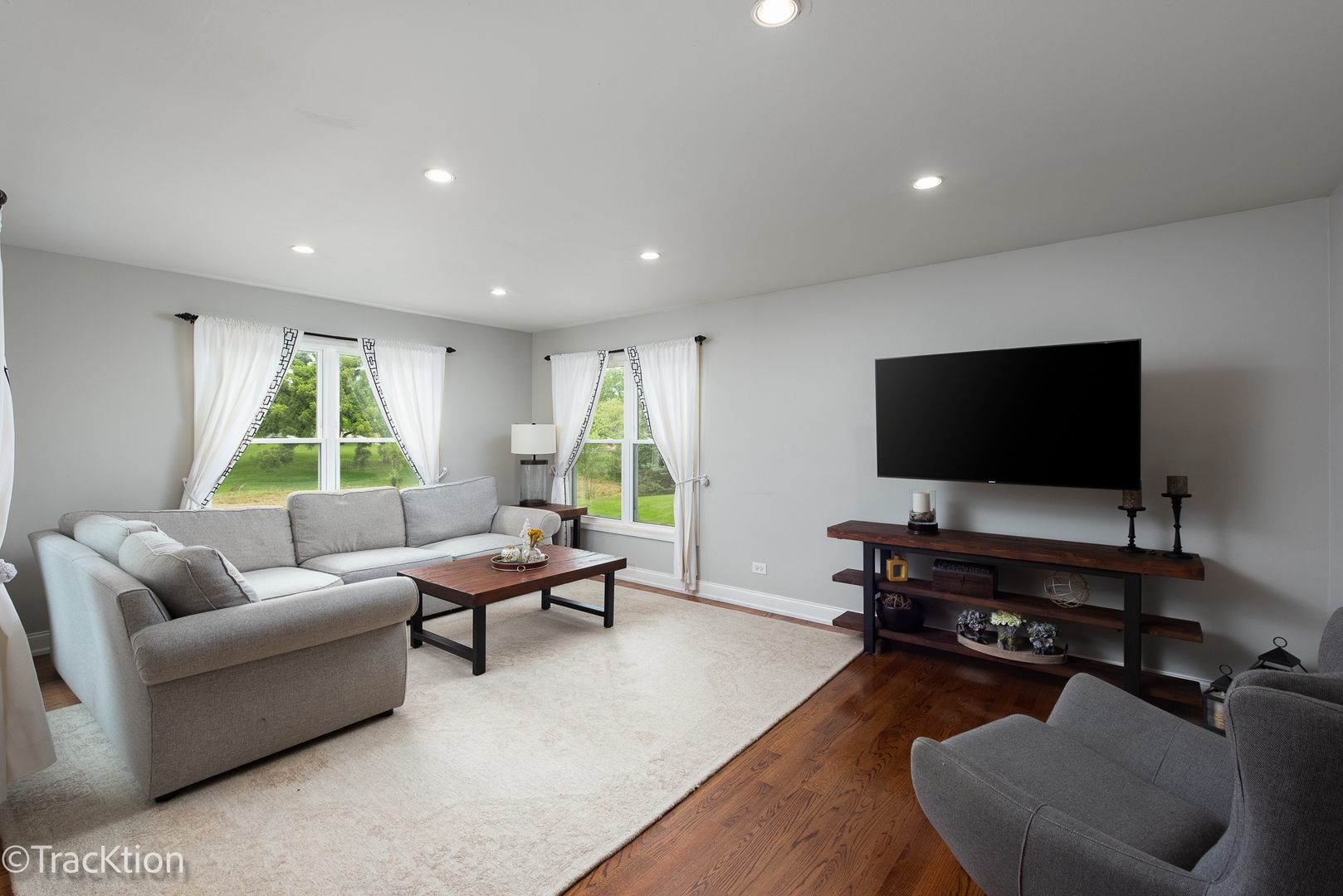 2184 Riverlea Circle Naperville, IL 60565 - Photo 8 of 20 a living room with furniture and a flat screen tv