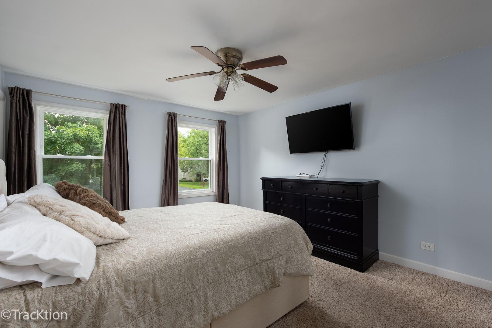2184 Riverlea Circle Naperville, IL 60565 - Photo 9 of 20 a bedroom with a bed and a flat screen tv